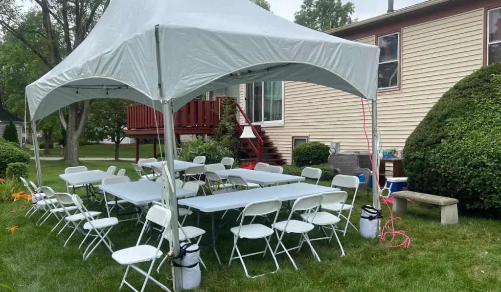 Outdoor setup featuring Tent Rentals & Classic Party Games with tables and chairs arranged for a family reunion in Chicago backyard.